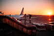 © David Prado/Stocksy - Airport terminal building with planes