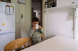 © Wells/Stocksy - Child in kitchen drinking from cup