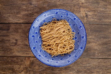 Poster - Homemade egg noodles in asian traditional bowl