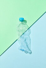 Crumpled Plastic Bottle With Shadows.