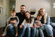 © Erin Drago Photography/Stocksy - Happy Family in Living Room