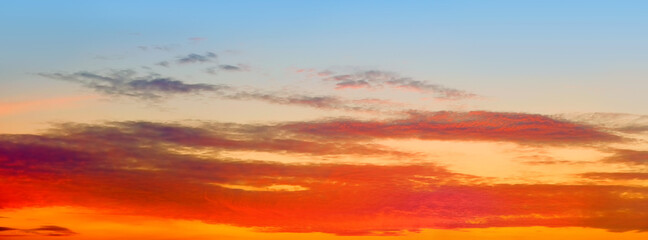Wall Mural - orange sunset sky panorama landscape background. panoramic cloudscape at dusk. mellow sunrise ultra 