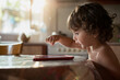 © BIG BLUE PRODUCTIONS SINGLE MEMBER PC - VAT 801021892/Stocksy - 2 year old boy using a digital tablet