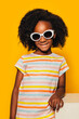 © MyMicrostock/Stocksy - Portrait of Little Adorable girl in Studio with Sunglasses