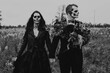 © Chelsea Victoria/Stocksy - A skeleton themed engagement shoot
