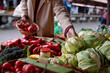 © Jovo Jovanovic/Stocksy - Autumn fresh produce - woman buying fresh vegetables at farmers market