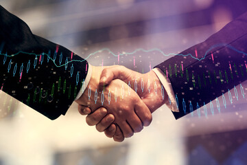 Double exposure of forex graph hologram and handshake of two men. Stock market concept.