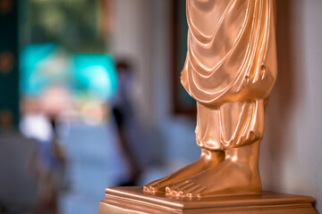 blurred abstract background of sculptures seen at temples or religious tourist sites (phaya nak, bud