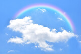 Fototapeta Tęcza - Abstract rainbow on beautiful blue sky and white clouds as background and wallpaper. 