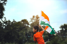 Little Indian Child Holding, Waving Or Running With Tricolour Flag