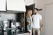 © Drobot Dean - Loving couple standing together indoors at home