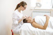 © Maria - The beautician makes the patient injections and the forehead area during the procedure of mesotherapy and botox