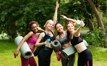 Cheerful Multiracial Girls In Sports Clothes Taking Selfie Before Their Outdoor Yoga Practice