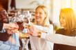 © Robert Kneschke - Friends celebrate birthday with wine in the restaurant