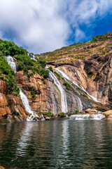 Wall Mural - Beautiful Ezaro waterfall on the Atlantic coast of Galicia in north western Spain.