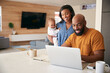 © Monkey Business - African American Family With Baby Daughter Using Laptop To Check Finances At Home