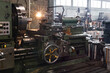 fragment of the factory hall with a lathe in the foreground