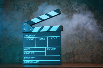 Movie clapperboard in blue light