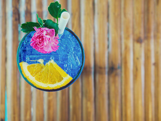 summer drink concept from blue Hawaiian drink with lemon topping. Drink for hot summer days..