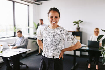 Businesswoman laughing in an office