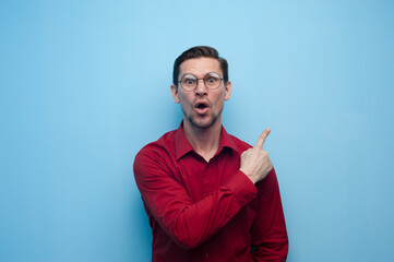 Wall Mural - Portrait of shocked surprised young man in glasses