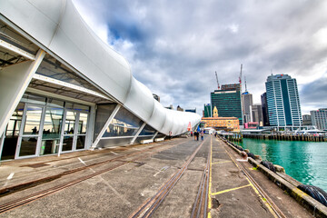 AUCKLAND, NEW ZEALAND - AUGUST 26, 2018: City promenade along the ocean, port area on a sunny day