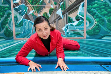 Poster - Happy female climber at the top of an ascent