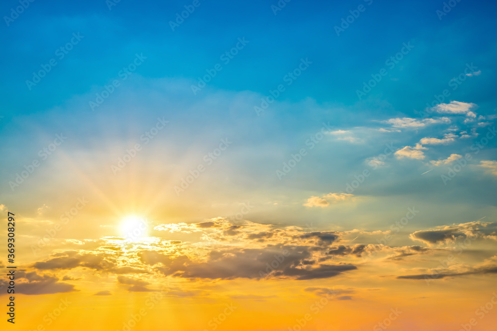 Beautiful blue summer sky with bright sun at sunset as a background - obrazy, fototapety, plakaty 