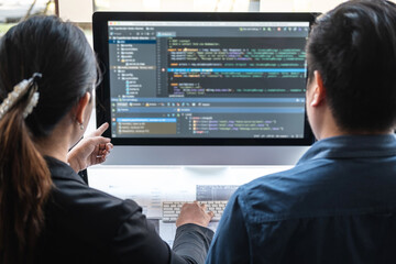 Wall Mural - team of programmer brainstorming and programming in website working a software