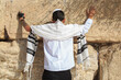 Jewish  teenager praying at the Western wall in Jerusalem