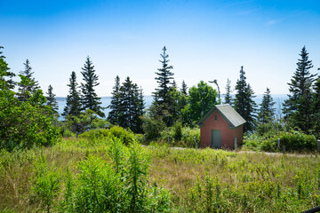 old red brick building in a field