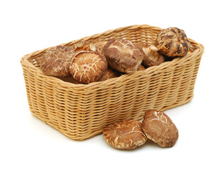 Wall Mural - Dried mushrooms isolated in basket on a white background