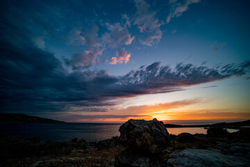 Poster - Beautiful dramatic sky during sunset over the sea