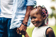© Art_Photo - Portrait of enjoy happy love black family african american father holding little african girl hand in moments good time in summer park at home