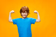 © SHOTPRIME STUDIO - Beautiful red-haired boy shows the muscles of his arms