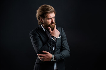 thoughtful and serious. official office lifestyle. serious bearded man. handsome and successful man in expensive suit. He is in shirt. stylish successful man in suit posing. business man wear suit