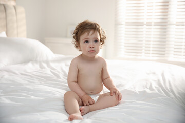 Poster - Cute little baby on bed at home