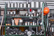 fragment of industrial interior with a storage of metal products and tools in the workshop