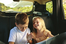 Kids Enjoying While Travelling By Car