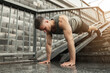 © blackday - Muscular man is doing push-ups during calisthenic workout on a street