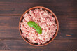 © Natalia Samorodskaia - Raw minced meat in bowl on wooden table