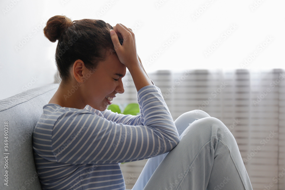 Portrait of young beautiful black woman with depressed facial ...