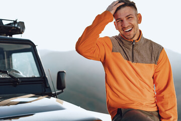 Wall Mural - Portrait of a young caucasian man hiking in the mountains