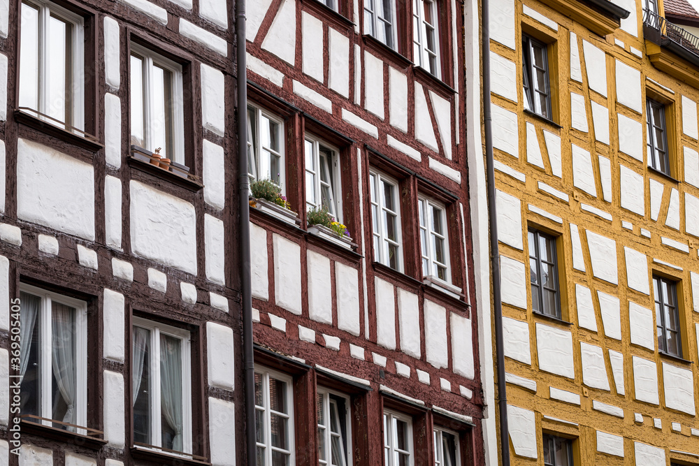 Detail of Half-timber work on the facade of wooden buildings in the German city of Nuremberg, Bavaria. German traditional architecture 'Fachwerkhaus' Timber framing Horizontal view