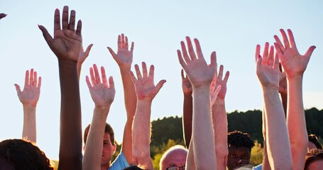 Wall Mural - Close up of volunteers' hands of mixed races and different ages. A group of happy eco activists putting, raising hands up to the sky. Friendship, teamwork, volunteering concept.