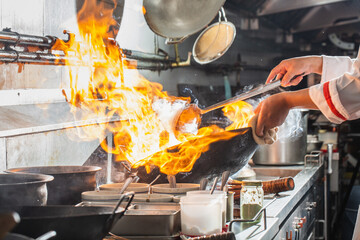 Wall Mural - Chef stir fry cooking