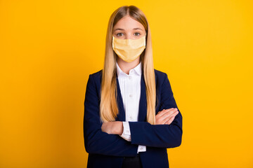 Poster - Close-up portrait of her she nice attractive long-haired schoolkid wearing safety mask folded arms mers cov wuhan disease prevention isolated bright vivid shine vibrant yellow color background