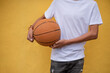 © rushay - Cropped shot of young person holding basketball