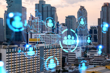 Hologram of social media icons over sunset panoramic cityscape of Bangkok, Asia. The concept of people connections. Multi exposure.