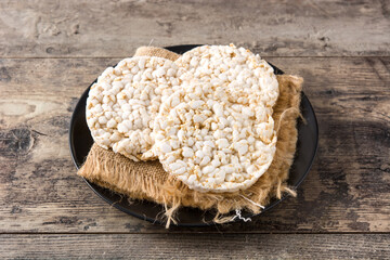 Wall Mural - Puffed rice cakes on wooden table 	